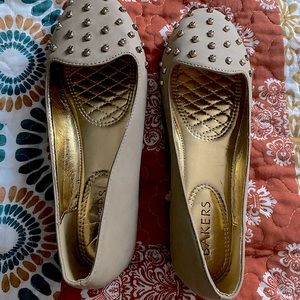 Cute Gold Slip on Flats with a pop of shoe art aka gold spikes.